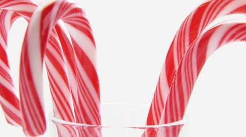 Red and white striped candy canes in a glass Video stock 8570870