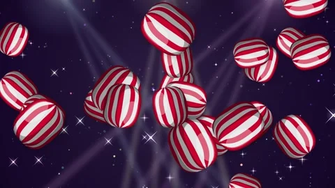 Red and White Striped Candy Objects Bursting Over Glittering Background Stock Footage 345703520