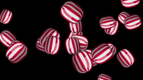 Red and White Striped Hard Candy Bursting on Black Background Stock Footage 346114991