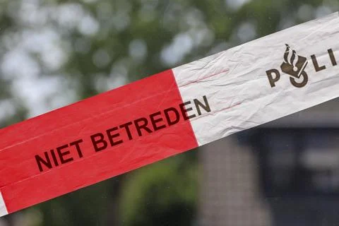 Red and white tape of Dutch police (politie)  at incident Stock Photos