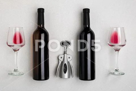 Red and white wine bottles and glasses, top view Stock Photos