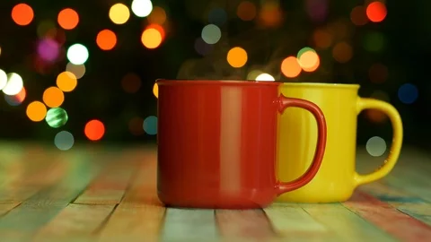 Red and yellow cups on the table on christmas background. Place for text Video stock 123084041