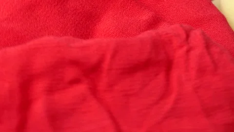 Red and yellow fabric background rotates on a board Video stock 248310330