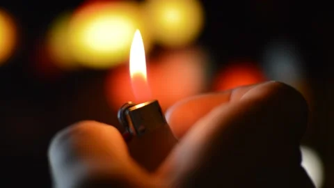 Red and yellow flame of a lighter in the night. light a lighter Stock-Footage 202307612