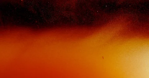 Red and yellow glowing cloud moving up and down, above white and red particles Stock Footage 115196492
