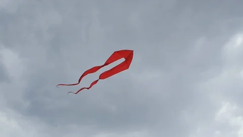 Red and Yellow Kite in the clouds Video stock 98142663