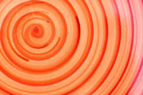 The red and yellow spiral pattern on a handmade dinner plate. Stock Photos