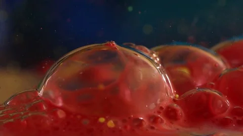 Red and Yellow Translucent Bubbles Pop Stock Footage 75503725