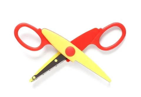 Red and yellow zig zag craft scissors for children, school supplies and creat Stock Photos