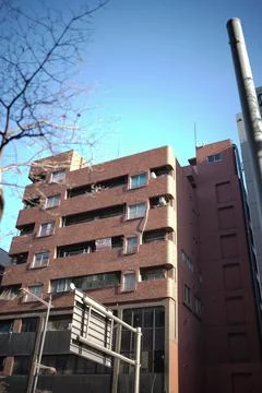 Red apartment building Stock Photos