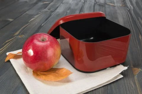 Red apple and a open empty  box for school lunch Stock Photos