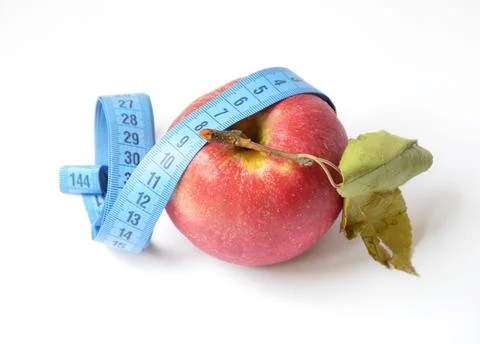 Red apple and soft centimeter on a white background. diet and proper nutrition Stock Photos