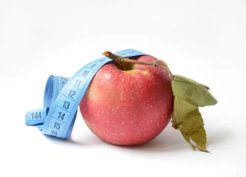 Red apple and soft centimeter on a white background. diet and proper nutrition Stock Photos
