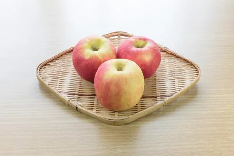 Red apple in basket Stock Photos