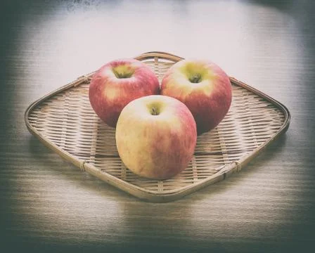 Red apple in basket Stock Photos