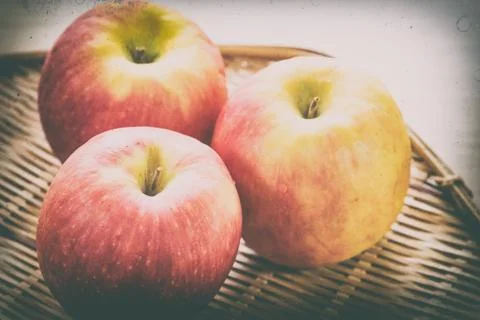 Red apple in basket Stock Photos
