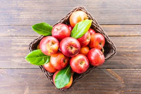 Red apple in basket Stock Photos