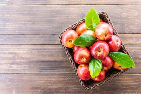 Red apple in basket Stock Photos