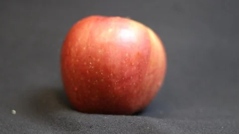 Red apple on a black background. Stock Footage 97968229