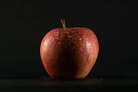 Red apple on black background Stock Photos