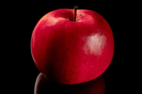 Red Apple on black background with reflection Stock Photos