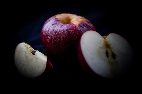 Red apple on a black background, shallow depth of field Stock Photos