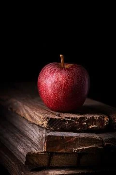 A red apple on black background, vertical Stock Photos