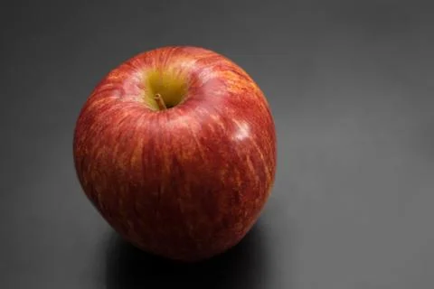 Red apple on black table, red apple background for good health concept Stock Photos