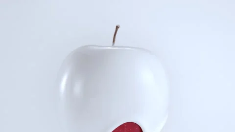 Red apple enveloped by white cream Stock Footage 219464497