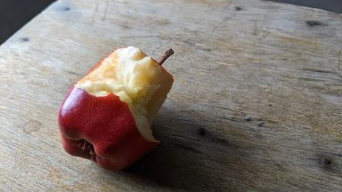Red apple fruit with bite marks Stock Photos