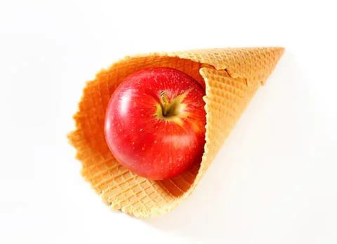 Red apple inside a waffle cone Stock Photos
