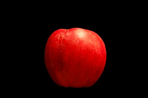 A red apple isolated with black background Stock Photos