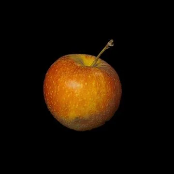 A red apple isolated on a black background in professional studio photography. A Stock Photos