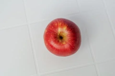 Red apple isolated on the white table. With clipping path. Stock-Fotos