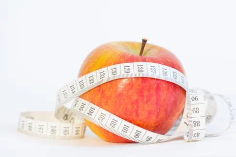Red apple with measuring tape Stock Photos