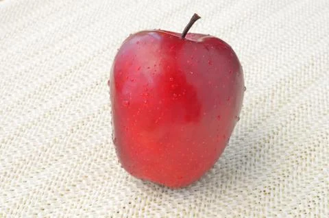 Red apple on napery Stock Photos
