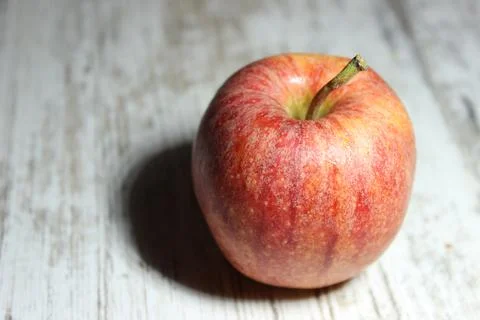 Red apple on an old table Stock Photos