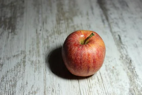 Red apple on an old table Stock Photos