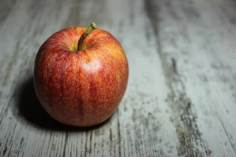 Red apple on an old table Stock Photos