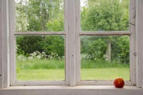 Red apple at an old windowsill Stock Photos