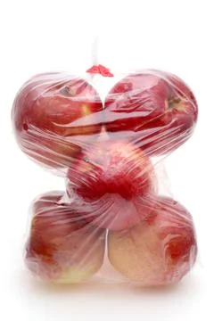Red apple in a plastic bag Stock Photos