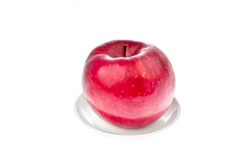 Red apple on a plate Stock Photos