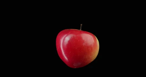 Red apple rotating with black background Stock Footage 233548566