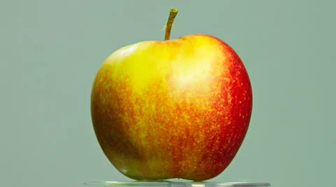 Red apple rotating on isolated background Stock Footage 60061980