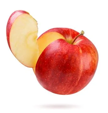 Red apple with a slice flies close-up on a white background. Isolated Stock Photos