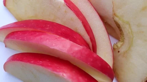 Red apple slices rotating slowly Stock Footage 139857584