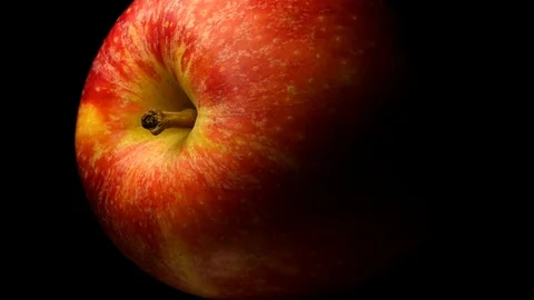 Red Apple spinning on a black background Stock Footage 119592118