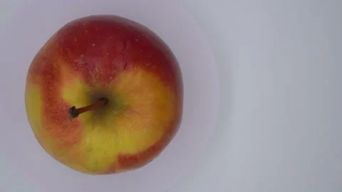Red apple on a spinning stand Stock Footage 141789003