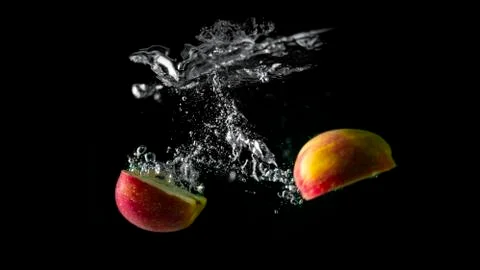 Red Apple Spliting Underwater Stock Photos