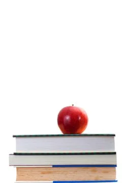 Red apple on stack old and newer books Stock Photos